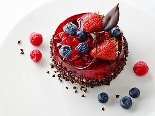 Image showing cake with fresh berries and chocolate