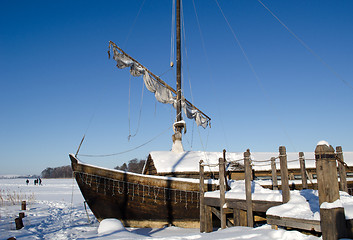 Image showing retro wooden ship frozen lake ice sail people walk 