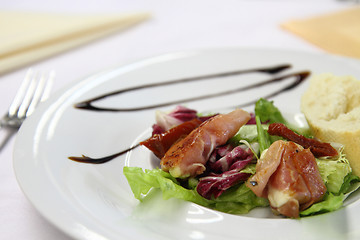 Image showing mozzarella grilled in the pig ham as gourmet food background