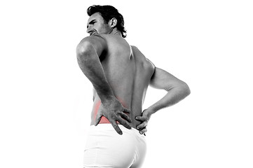 Image showing Young man holding his lower back in pain