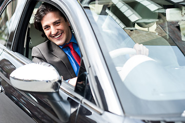 Image showing Portrait of handsome guy driving his car