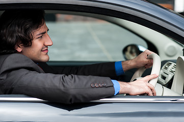 Image showing Man driving his car