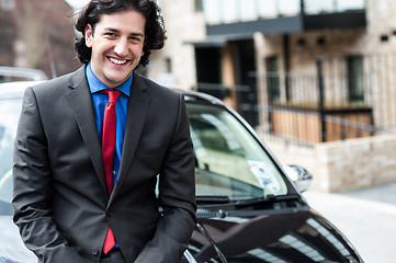 Image showing Handsome corporate man posing casually