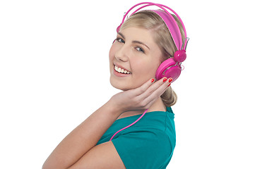 Image showing Blonde teen listening to music