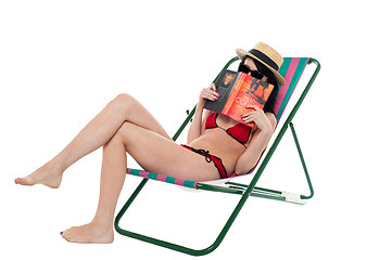 Image showing Bikini lady hiding her face with a book