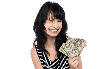 Image showing Smiling pretty girl with cash