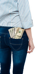 Image showing Girl carrying dollars in back pocket