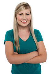 Image showing Cheerful pretty girl in casuals posing with folded arms