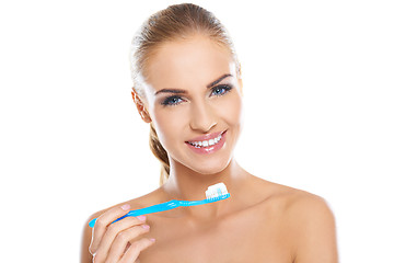 Image showing Beautiful woman with a toothbrush and paste