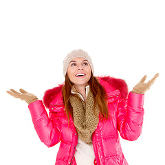 Image showing Young woman wearing winter jacket scarf and cap