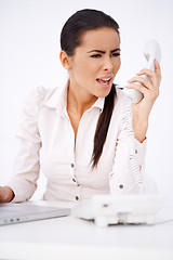 Image showing Woman yelling on somebody over telephone