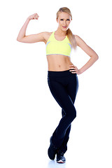 Image showing Sporty blond girl showing her muscles