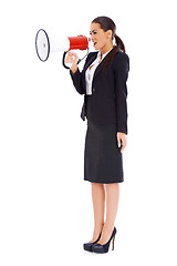 Image showing Business woman screaming loudly thru big megaphone