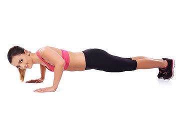 Image showing Beautiful woman doing press ups