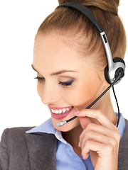 Image showing Pretty female businesswoman talking headset