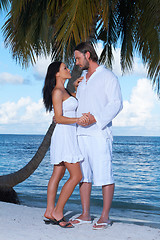 Image showing Couple nex to Palm tree