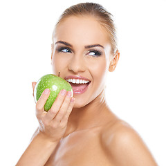 Image showing Smiling beauty holding green apple