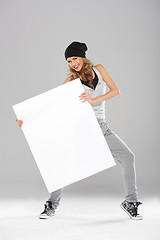 Image showing Young fashionable modern dancer holding empty board