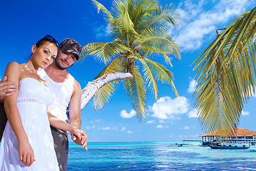 Image showing Couple nex to Palm tree