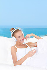 Image showing Cute woman listening to music