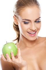 Image showing Happy woman with a crisp green apple