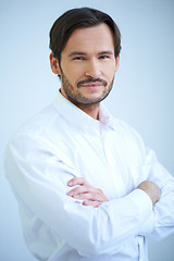 Image showing Smiling man in shirtsleeves