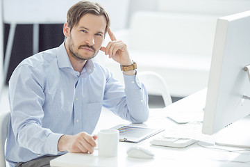 Image showing Handsome Businessman working at his desk