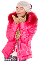 Image showing Young woman wearing winter jacket scarf and cap