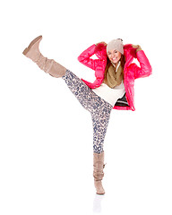 Image showing Young woman wearing winter jacket scarf and cap