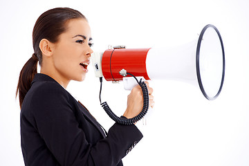 Image showing Business woman screaming loudly thru big megaphone