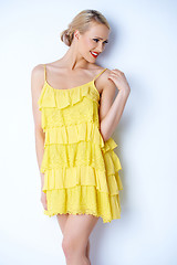 Image showing Sexy blond woman in yellow dress