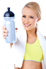 Image showing Cute sporty blond woman holding water bottle