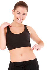 Image showing Woman checks the waist fatness on white