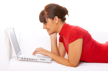 Image showing Girl with laptop on couch