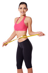 Image showing Happy slim woman measuring her waist