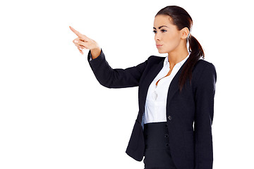 Image showing Business woman pointing at empty space