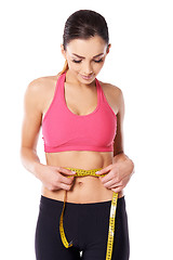 Image showing Young athlete measuring her waist