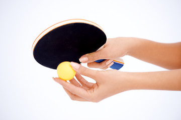 Image showing Hands holding table tennis rocket and ball