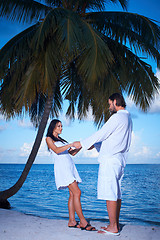 Image showing Couple nex to Palm tree