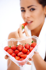 Image showing Woman holding heart shaped box of strawberries
