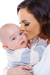 Image showing Loving mother kissing her small baby