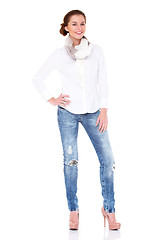 Image showing Young sexy brunette woman in white shirt and blue jeans