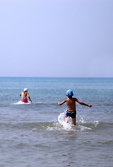 Image showing Children playing in the sea