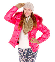 Image showing Young woman wearing winter jacket scarf and cap