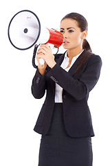 Image showing Business woman screaming loudly thru big megaphone