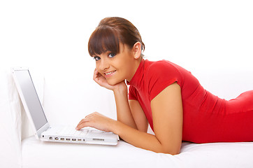 Image showing Girl with laptop on couch