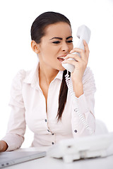 Image showing Woman yelling on somebody over telephone