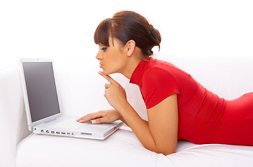 Image showing Girl with laptop on couch