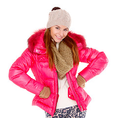 Image showing Young woman wearing winter jacket scarf and cap