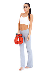 Image showing Full body shot of a woman wearing boxing gloves